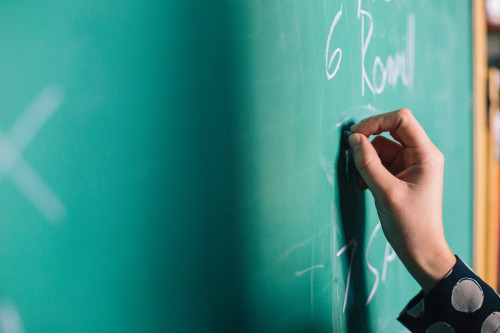 hand writing on chalkboard