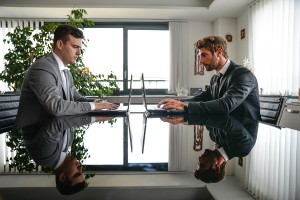 Business Man At Computer Desk