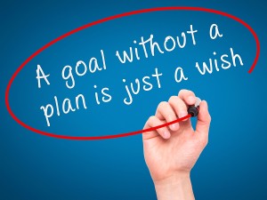 Man Hand writing "A goal without a plan is just a wish" black ma
