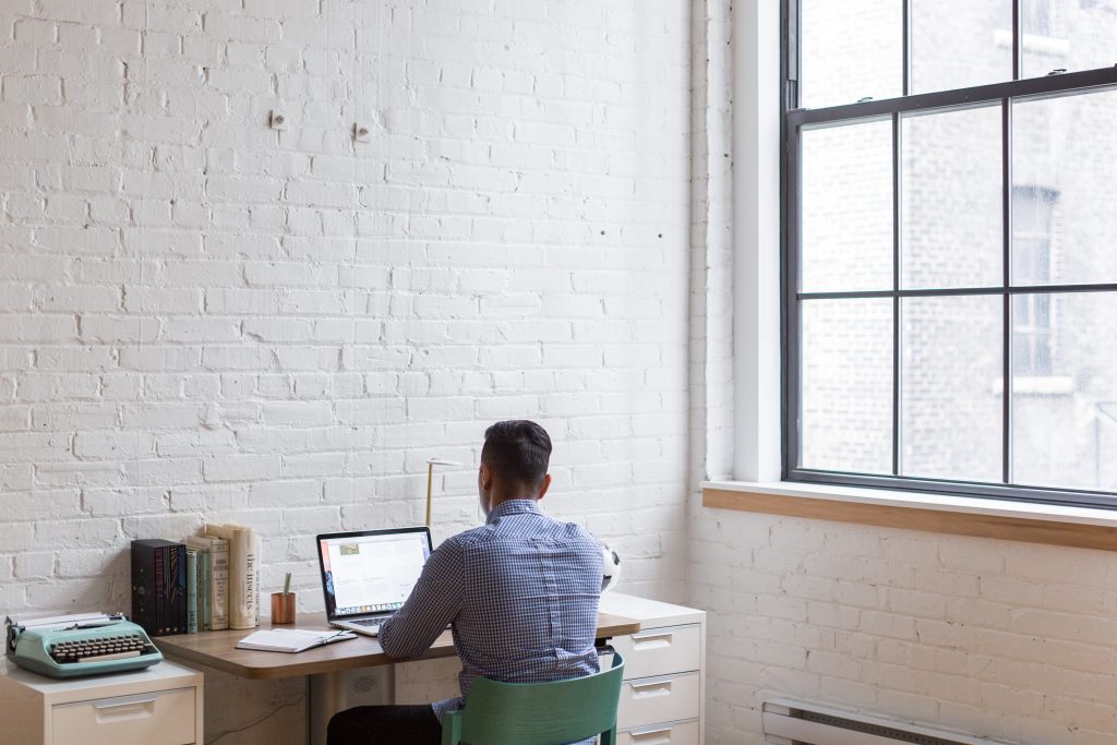 man sitting at desk